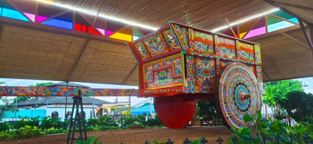 Close-up of the traditional hand-painted mandala patterns on a Sarchí ox cart