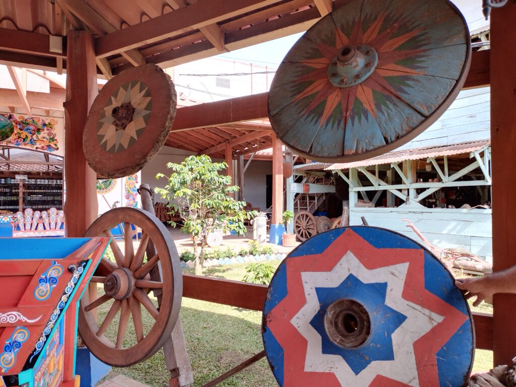 Traditional ox cart workshop in Sarchí where artisans hand-paint carretas